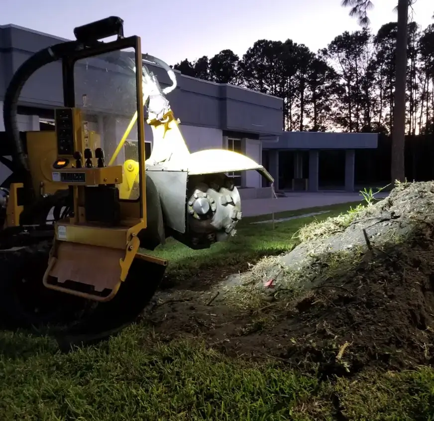 Stump grinder working a commercial Kansas City property